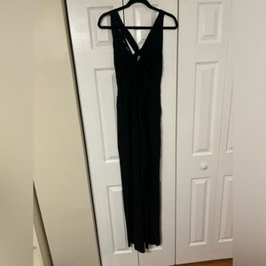 Used guess jumpsuit in black size 6